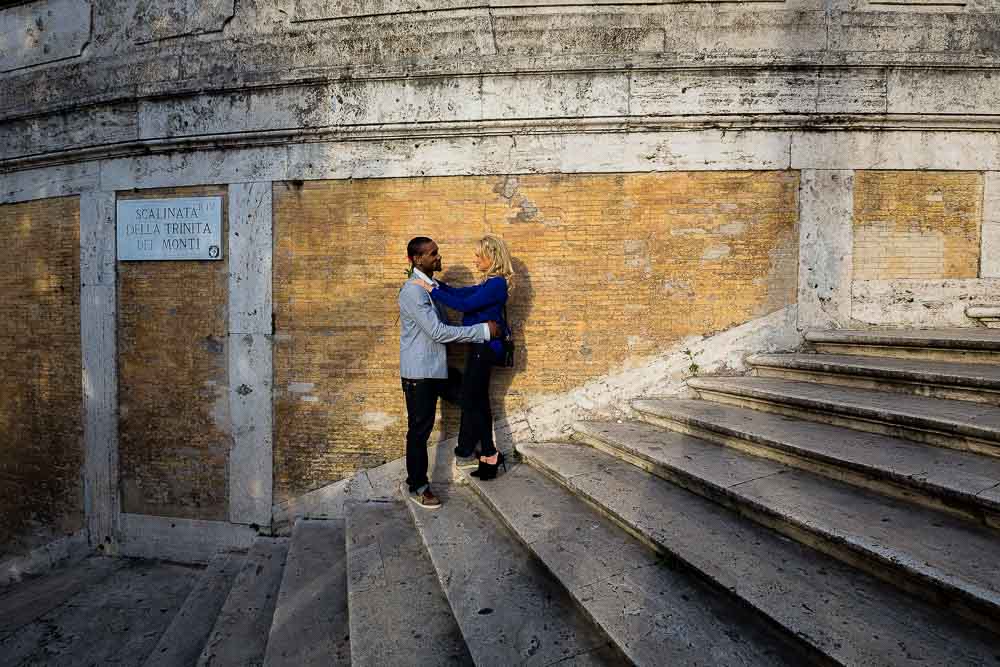 Standing on the Spanish steps during an engagement session