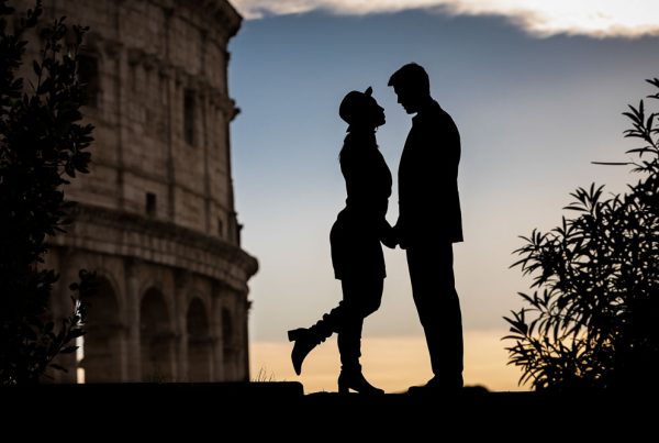 Silhouette image at the Roman Colosseum. Engagement photos in Rome, Italy.