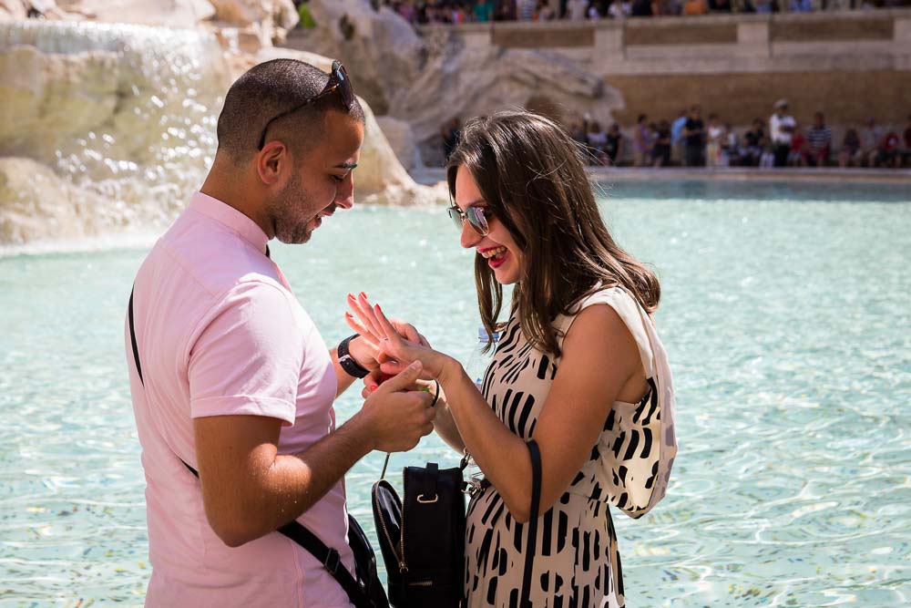 Couple looking at the engagement ring in joy and happiness