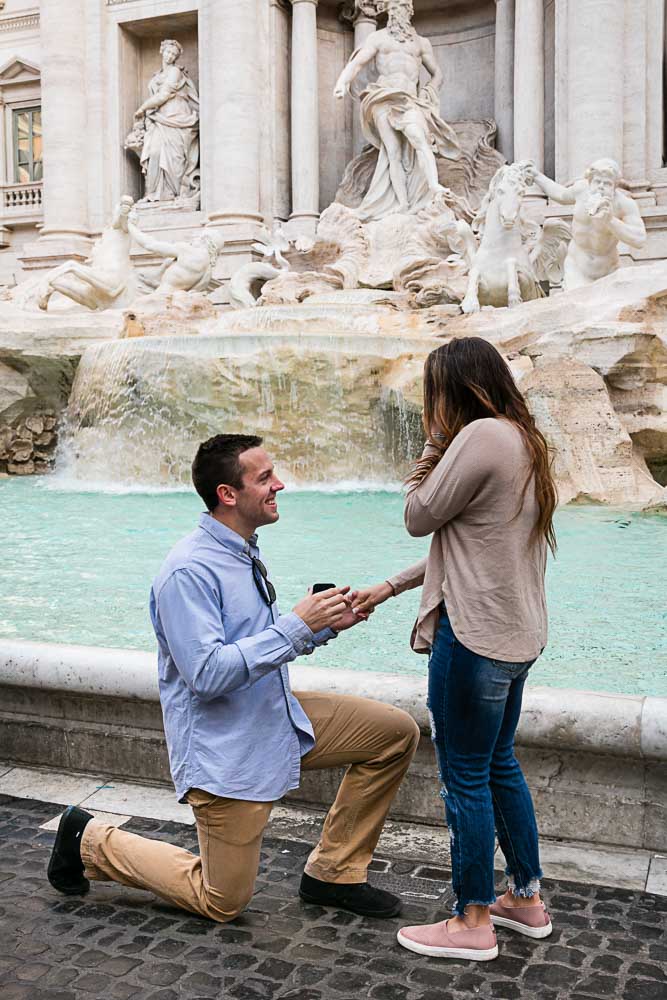 Surprise wedding proposal at the Trevi fountain in Rome Italy