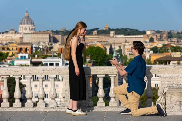 Marriage proposal in Rome before the sweeping view of the Roman skyline