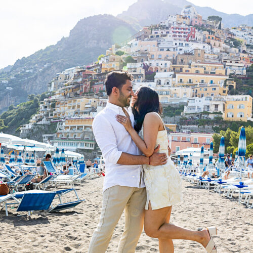 Taking fun and happy engagement pictures on Spiaggia Grande in Positano