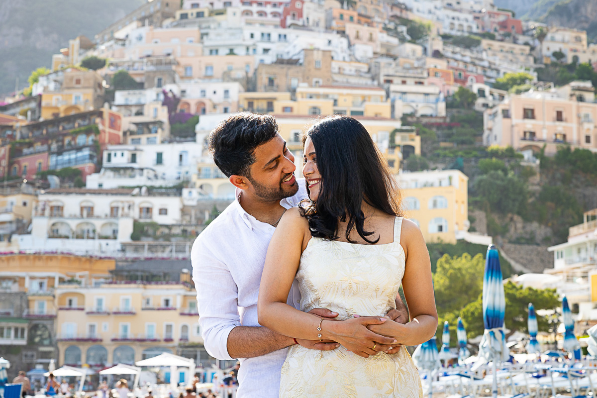 Couple portrait picture snapped in front of the vertical town in the background