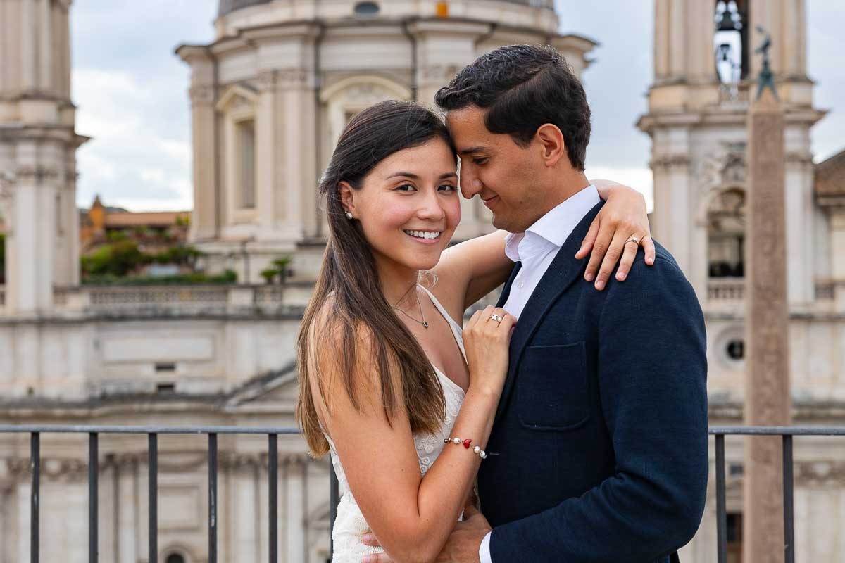 Posed portrait of a couple during a terrace photo shoot in Rome Italy after a romantic proposal session 