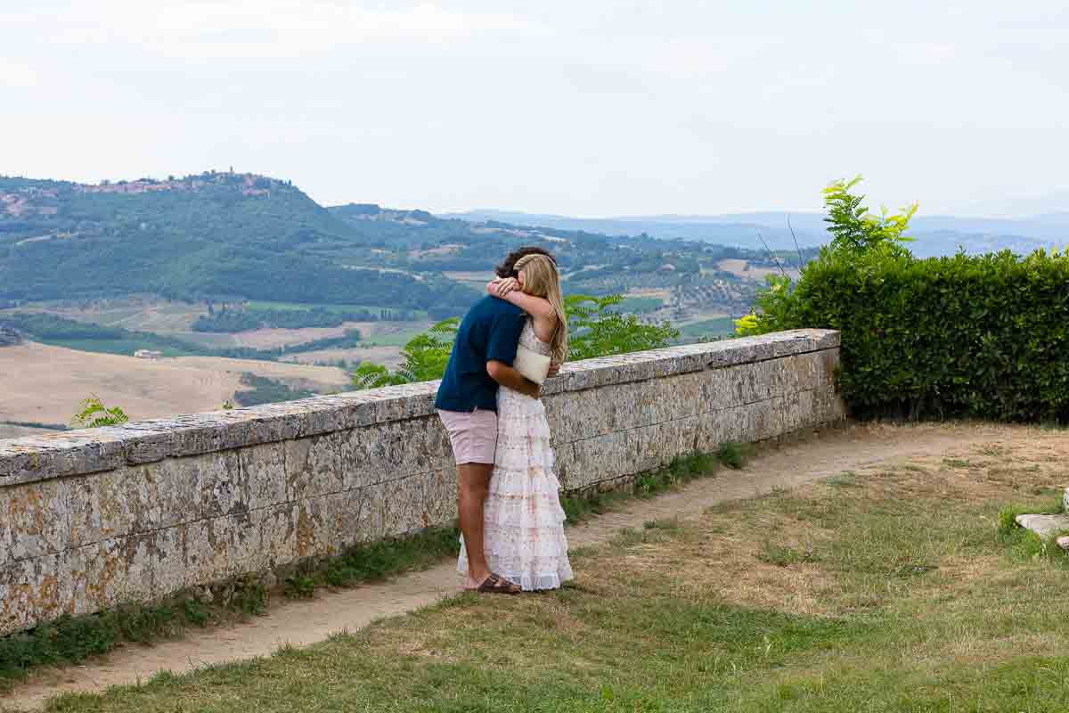 The moment in which the answer to the proposal was a joyful yes. Couple embracing during a proposal photoshoot in Tuscany 