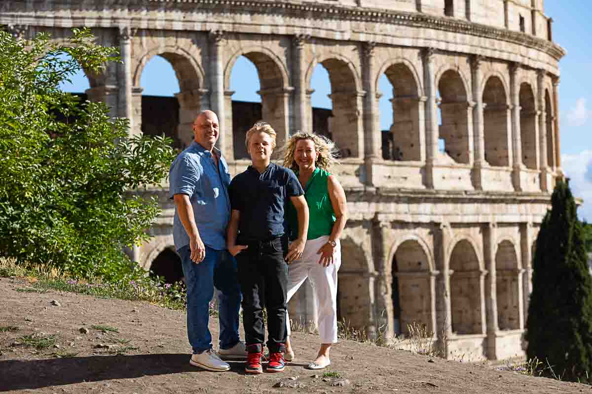 Standing up before the majest Colosseum during a Rome family photo shoot 