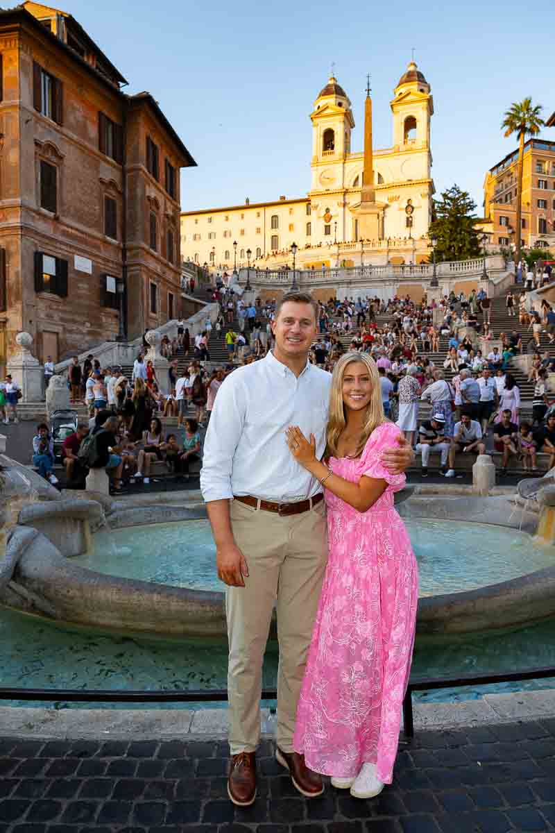 Standing in front of the Spanish steps for an engagement photo shoot at Piazza di Spagna 