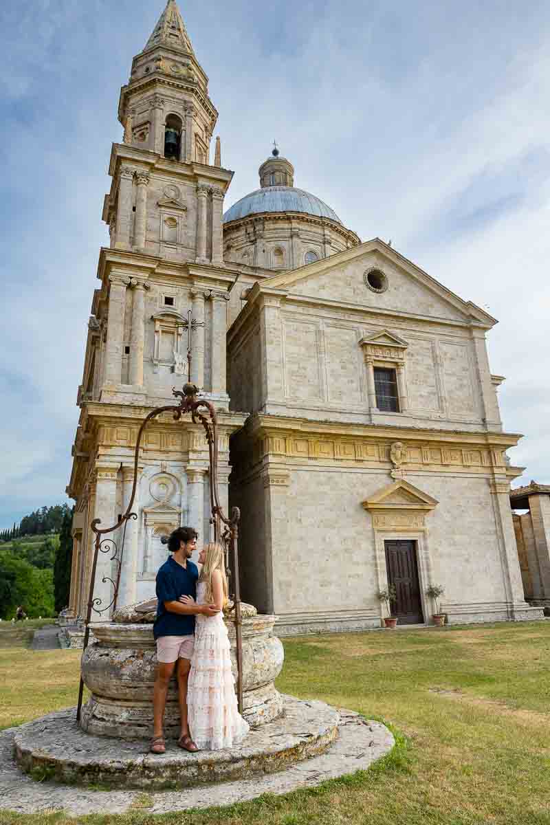 Couple posing in front of the San Biagio church found in Montepulciano. After the perfect proposal photography session 