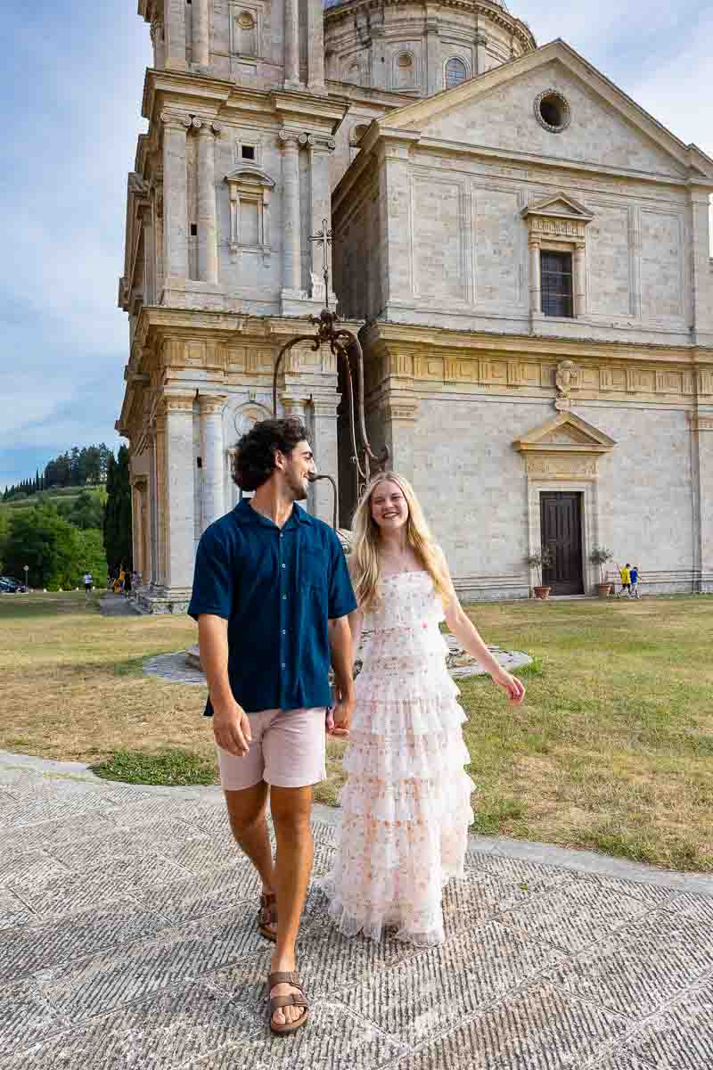 Walking in front of the church facade during a tuscan photoshoot 