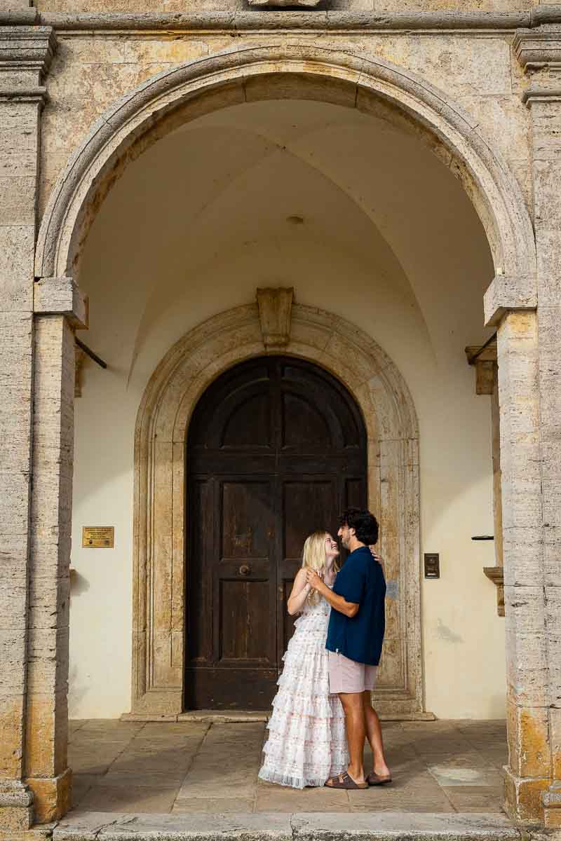 Dancing underneath the portico columns and ancient doorway 