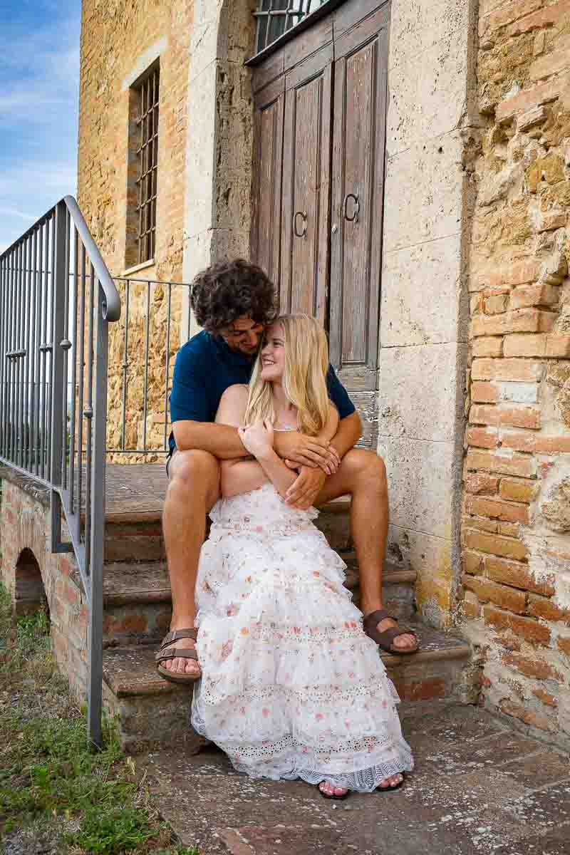 Intimate sitting down shots of a couple together in the Tuscan countryside 