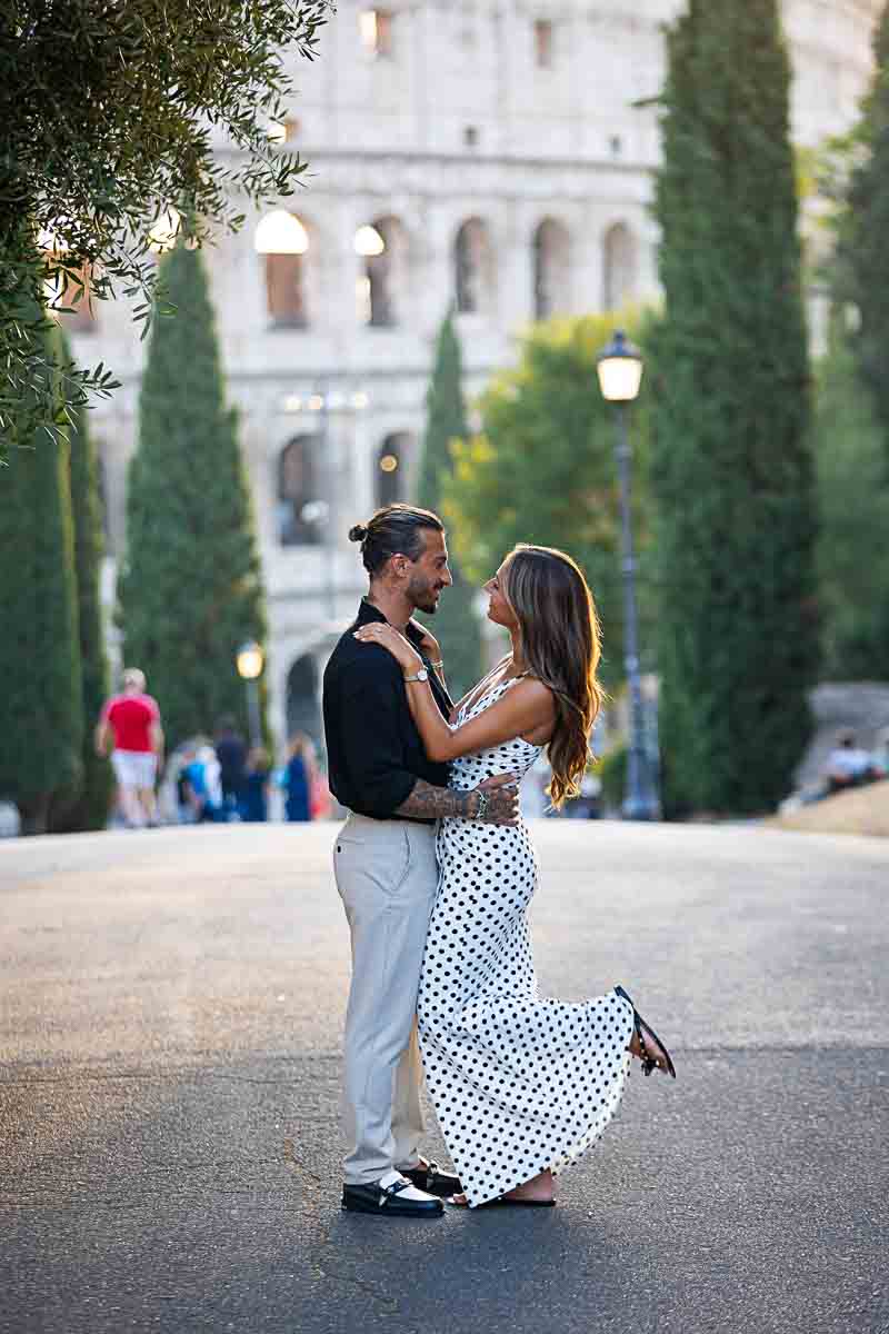 Standing together in a street in Rome posing after a beautiful surprise wedding proposal