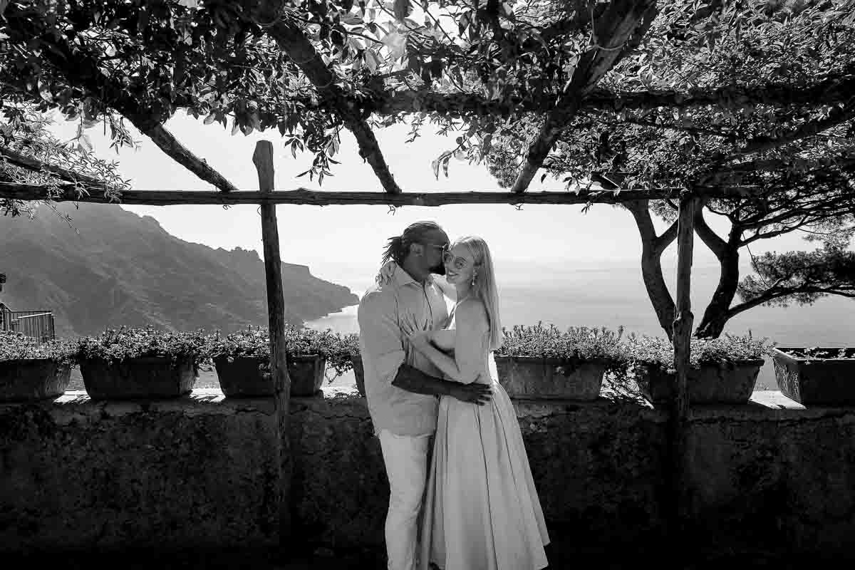 Posed couple before the mediterranean sea on the Amalfi coast 