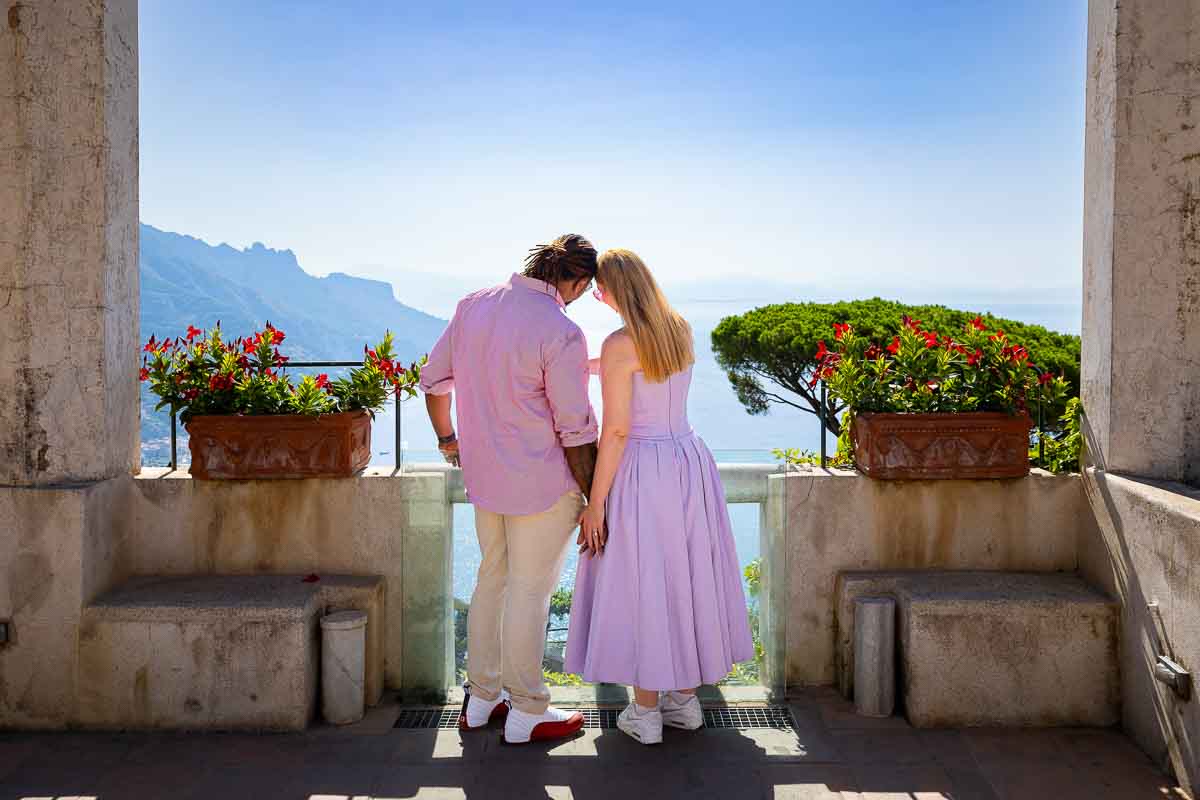 Couple together admiring the view of the coast of Amalfi in Italy 