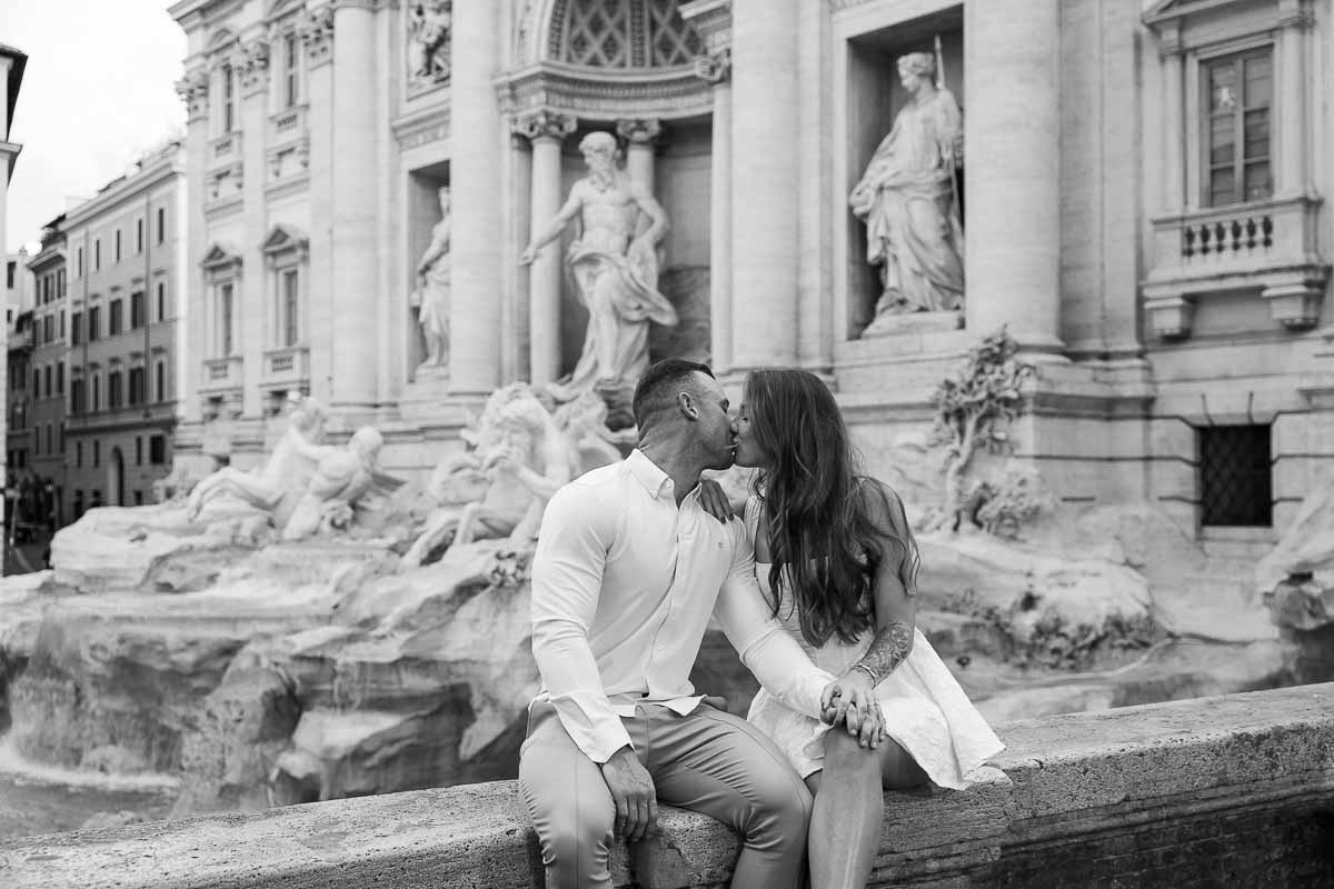 Kissing in Rome in black and white photography after a romantic fontana di trevi proposal