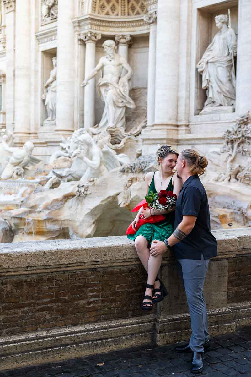 Full figure framed couple while engaged after a Trevi Surprise Wedding Proposal 