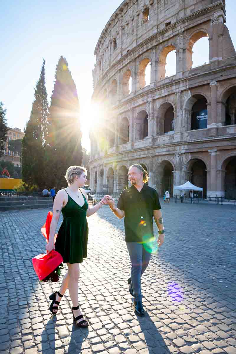 Colosseum photography session together with a just engaged couple after a Trevi surprise wedding proposal