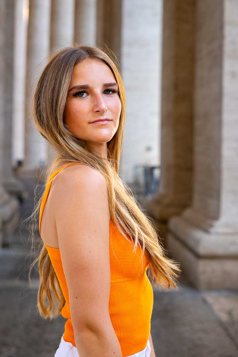 Sideway senior portrait picture under Vatican's columns