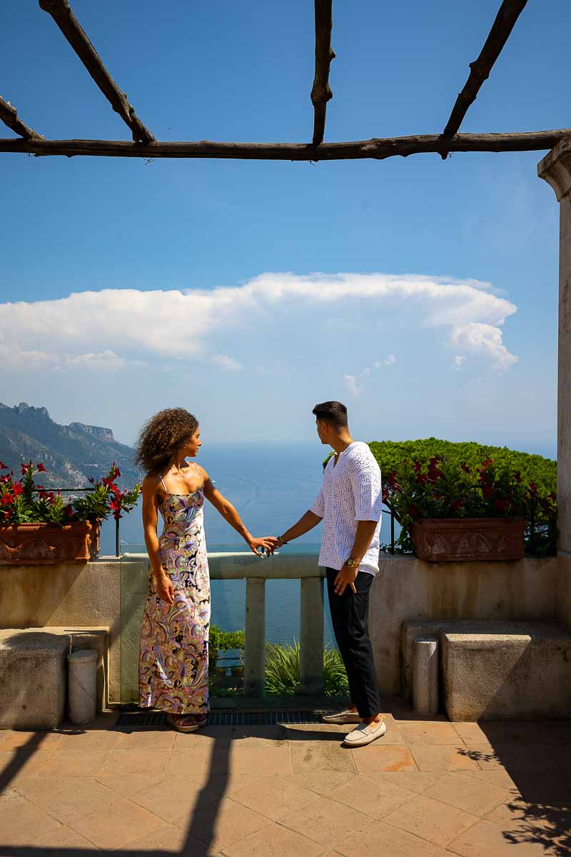 Holding hands and admiring the view over the Amalfi coast in Italy