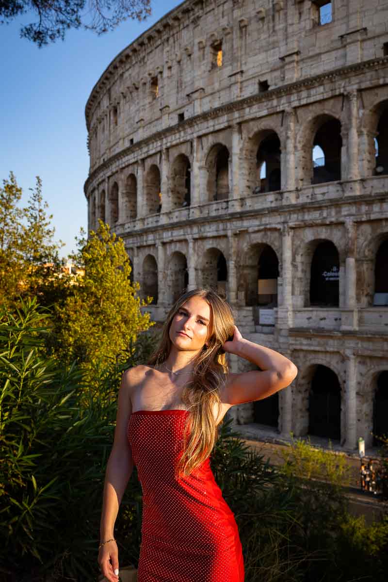 Posed by the Colosseum at sunset during a photo shoot in Rome to take senior pictures