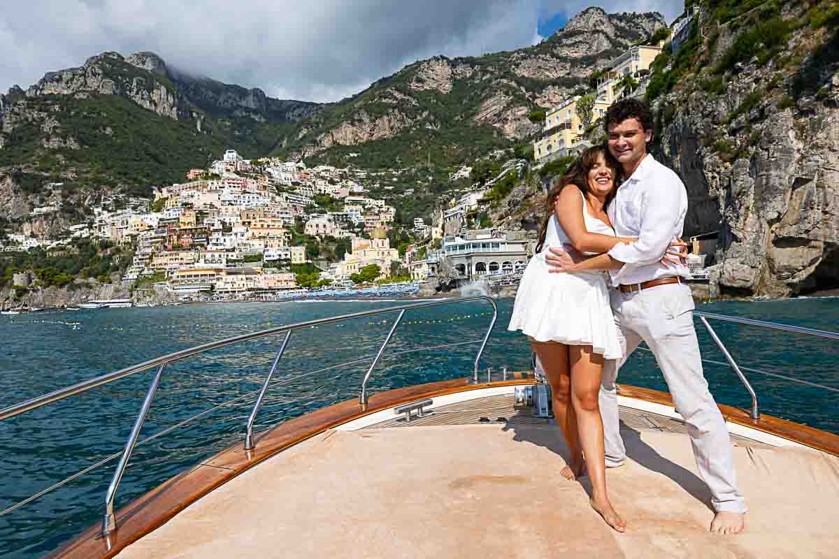 Just engaged on a boat in Positano after a surprise wedding proposal candidly photographed on a private ship