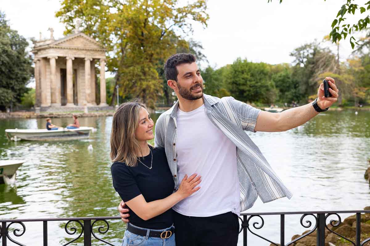 Couple taking a selfie at the Villa borghese park 