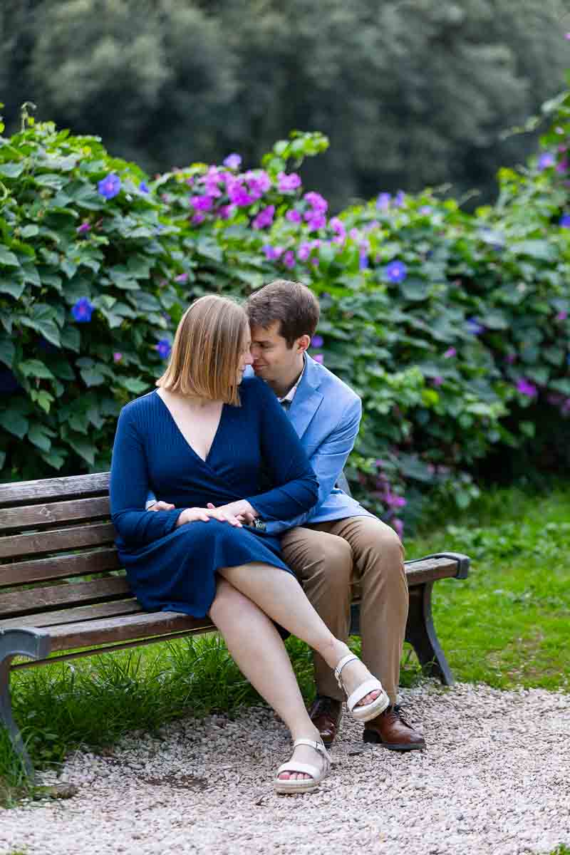 Sitting on a par bench in the park during a couple photo shoot in Rome Italy 