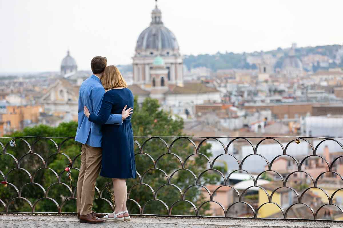 Couple admiring the view from the Pincio terrace outlook after proposing marriage 