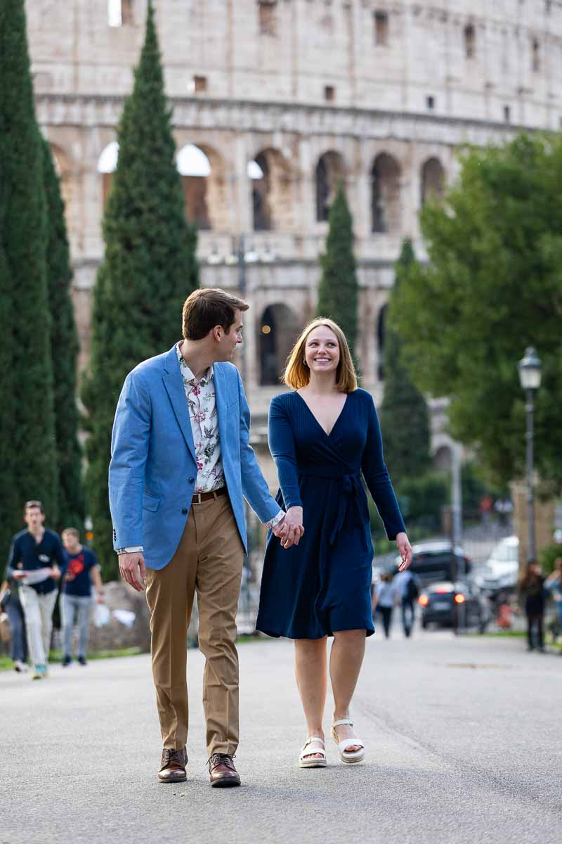 Walking together in photos with the Colosseum in the background