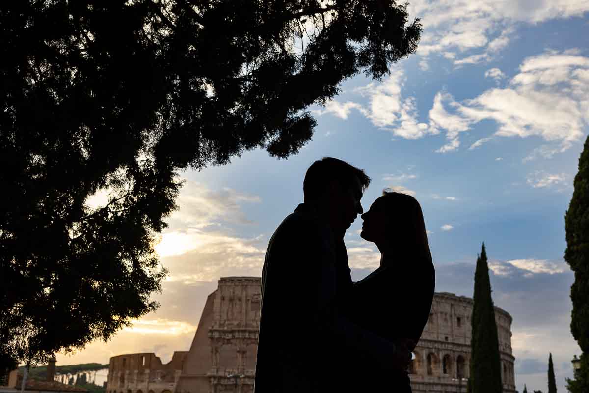 Silhouette picture of a couple kissing in front of the Colosseum in Rome Italy during a professional photographer session