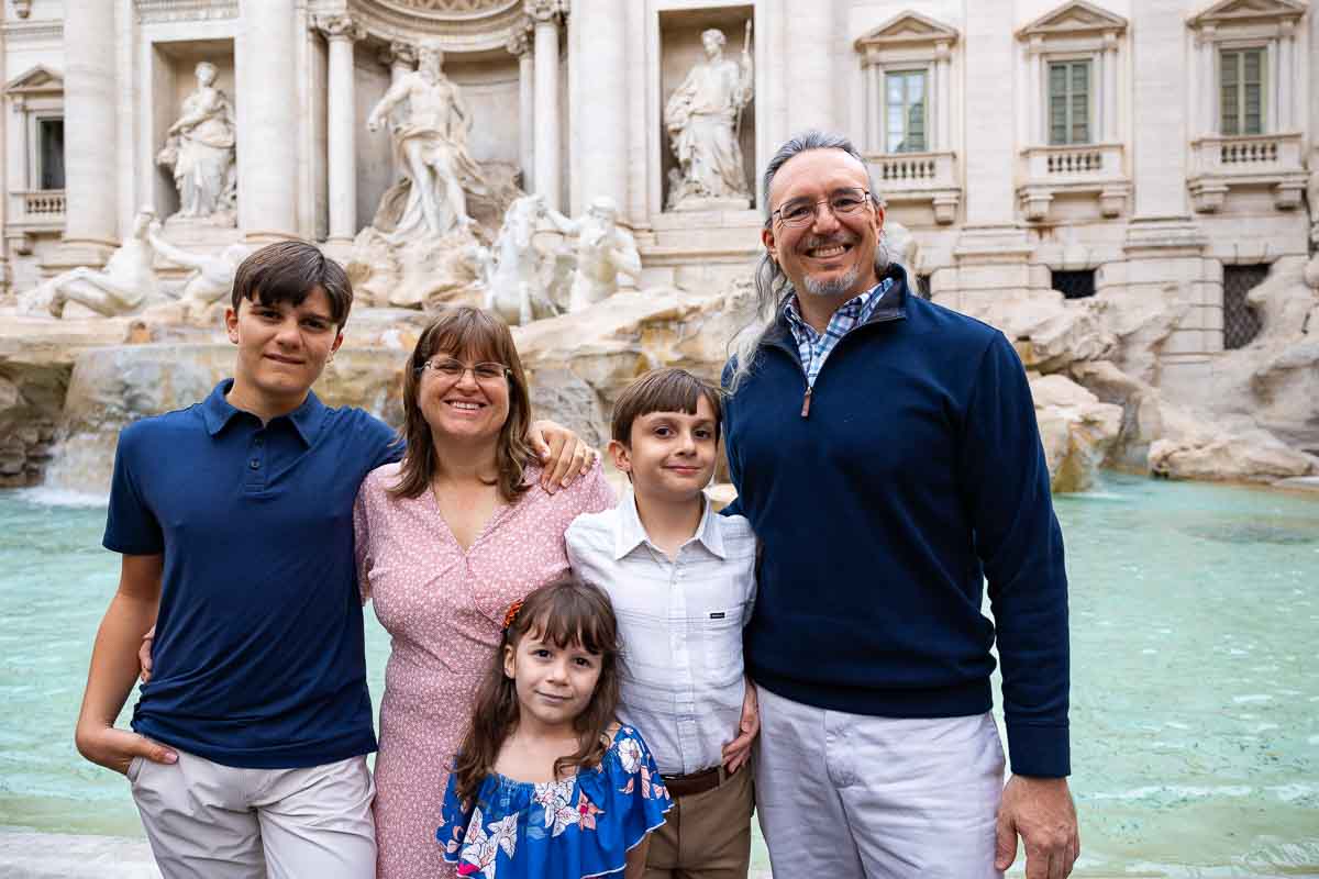 Horizontal version of the family photos standing in front of the Trevi fountain