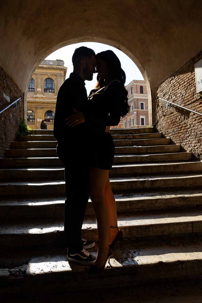 Silhouette image of a couple standing on top of the Borgia staircase during a Rome photographer session