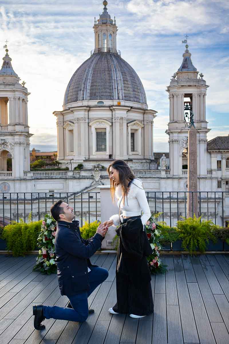 Rome Private Terrace Proposal. Kneeling down to ask the very important question overlooking a beautiful church in Rome