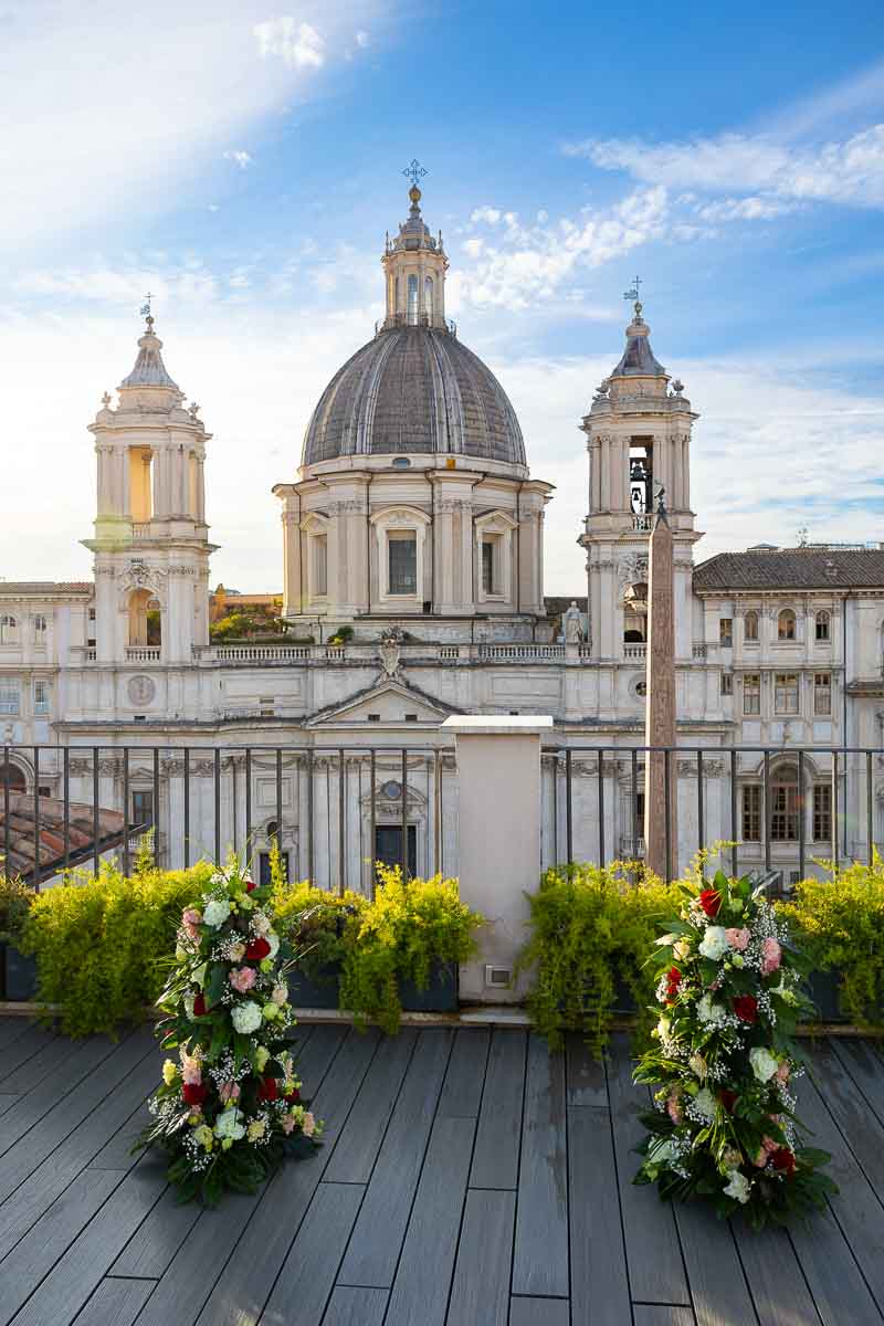 Terrace flower decorations set up before the church facade