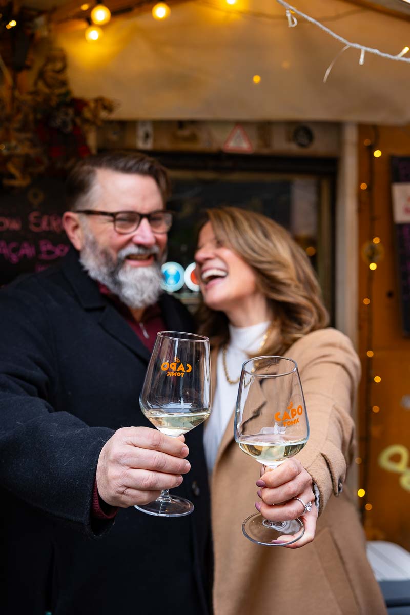 Couple celebrating engagement with a prosecco toast 