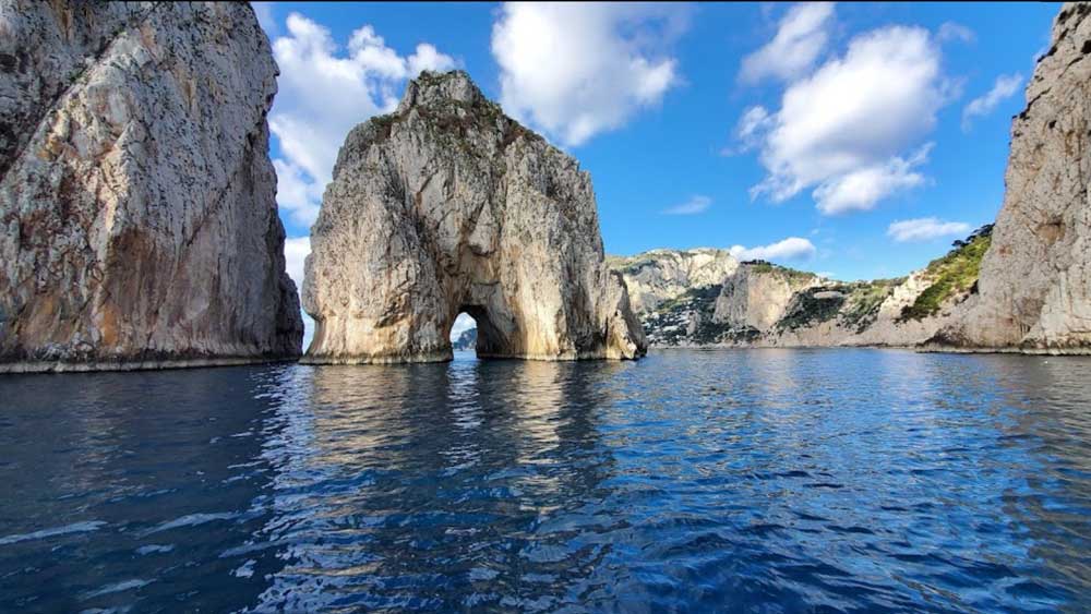 The Faraglioni Rocks are three towering sea stacks off the coast of the island 