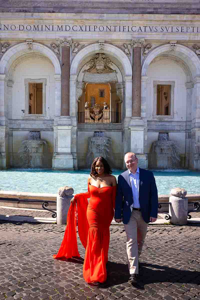 Walking hand in hand during a pregnancy photography session in Rome Italy with a professional photographer 